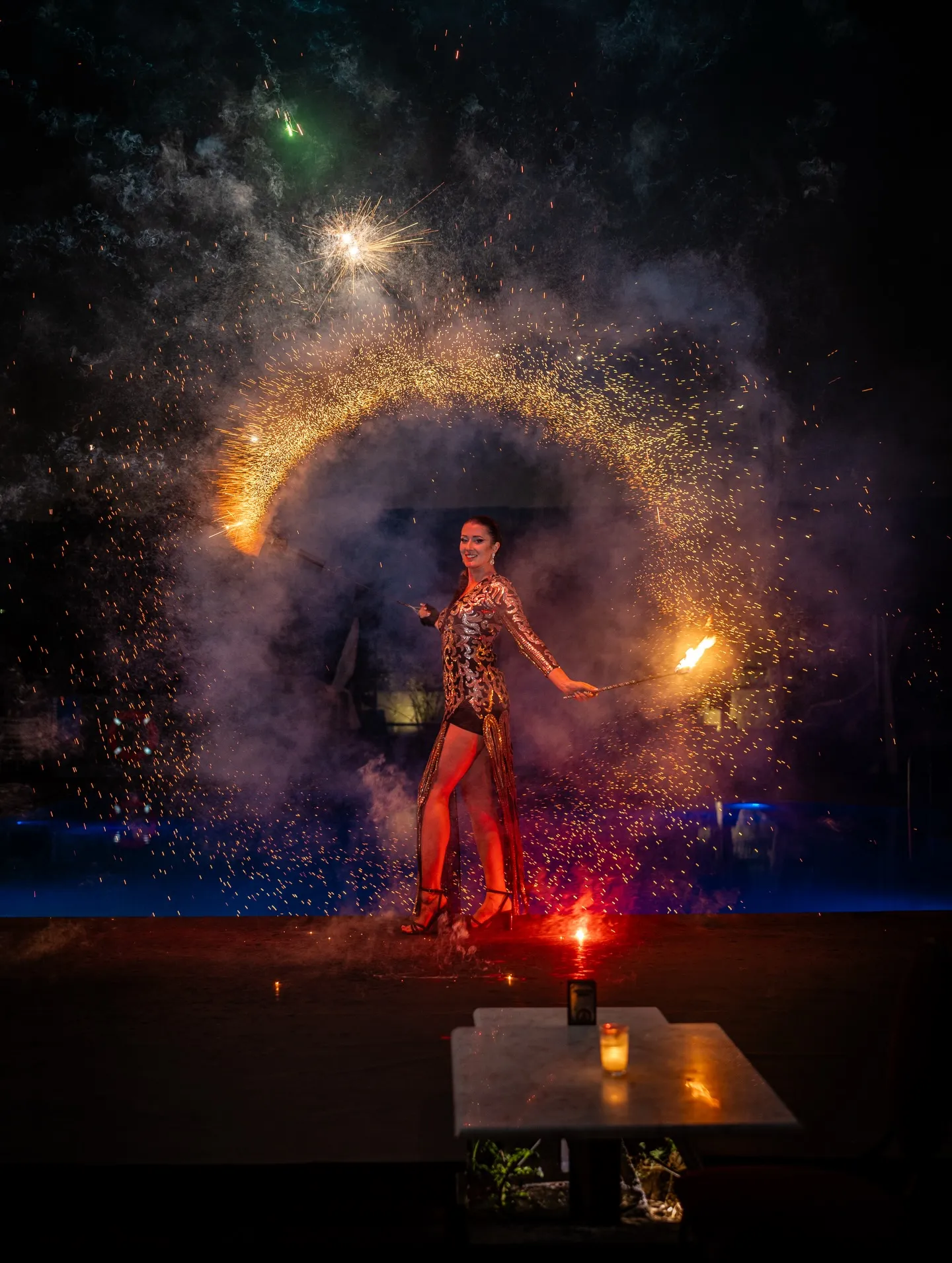 Fire artist inside a ring of sparks on the LOV terrace